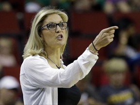 FILE - In this July 12, 2017, file photo, Seattle Storm head coach Jenny Boucek gestures during a WNBA game against the Connecticut Sun, in Seattle. The Seattle Storm have fired Jenny Boucek and promoted assistant Gary Kloppenburg to interim head coach for the remainder of the season.The team announced the moves Thursday, Aug. 10, 2017. The Storm (10-16) have lost four straight games and are fighting to make the playoffs. (AP Photo/Elaine Thompson, File)