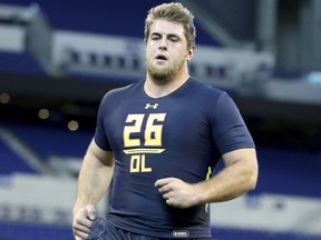 FILE - In this March 3, 2017, file photo, Western Kentucky offensive tackle Forrest Lamp competes in a drill at the 2017 NFL football scouting combine in Indianapolis. Los Angeles Chargers rookie offensive lineman Forrest Lamp was taken off the field on a cart Wednesday, Aug. 2, 2017 with an apparent knee injury. Lamp was hurt during the Chargers' fourth workout of training camp. The injury was an unwelcome sight for a franchise that struggled with inordinate injury problems over the past two seasons in San Diego.  (AP Photo/Gregory Payan, File)