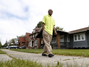 John Hall walks in his neighborhood in Detroit on Friday, May 19, 2017. Hall, convicted of murder, was sentenced to life without parole at the age of 17 and freed at 67. Years passed with few visitors. He wanted to do his time, he says, without leaning on family for help. His mother made eight trips to see him before her death in 1983. But her words helped him keep going. "`As long as there's life, there's hope,'" she'd told him. "`You've got a chance.'" (AP Photo/Paul Sancya)
