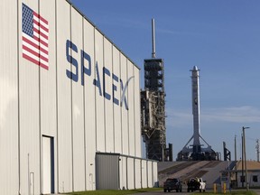 In this photo provided by NASA, a SpaceX Falcon 9 rocket and Dragon spacecraft await liftoff from NASA Kennedy Space Center's Launch Complex 39A in Cape Canaveral, Fla., on Monday, Aug. 14, 2017. SpaceX is about to launch a few tons of research to the International Space Station -- plus ice cream. (Kim Shiflett/NASA via AP)