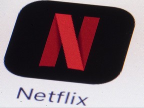 FILE - This Monday, July 17, 2017, file photo shows the Netflix logo on an iPhone in Philadelphia. Much of the attention showered on Netflix focuses on its insatiable appetite for original content. But this streaming network's multi-billion-dollar annual outlay for new programming necessitates another challenge: Matching each program with the subscribers who are likely to enjoy it. Netflix tags content, then identifies viewer habits. (AP Photo/Matt Rourke, File)