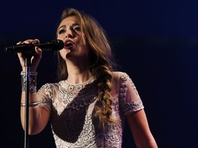 FILE - In this Tuesday, Oct. 13, 2015, file photo, Lauren Daigle performs during the Dove Awards in Nashville. Producer-songwriter Wayne Haun, Daigle and rock singer Zach Williams are the top nominees at the 2017 GMA Dove Awards, honoring gospel and Christian music, announced Wednesday, Aug. 9, 2017. (AP Photo/Mark Zaleski, File)