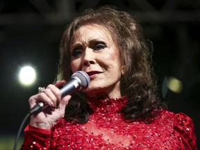 FILE - In this March 17, 2016, file photo, Loretta Lynn performs at the BBC Music Showcase at Stubb's during South By Southwest in Austin, Texas. The Country Music Hall of Fame and Museum is opening an exhibit on the life and career of Hall of Famer Loretta Lynn in Nashville. "Loretta Lynn: Blue Kentucky Girl" opens Aug. 25. 2017, and runs through Aug. 5, 2018. (Photo by Rich Fury/Invision/AP, File)