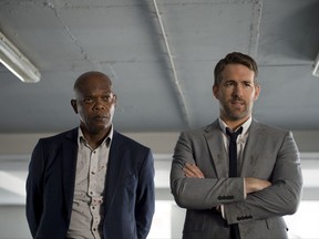 This image released by Lionsgate shows Samuel L. Jackson, left, and Ryan Reynolds in "The Hitman's Bodyguard." (Jack English/Lionsgate via AP)