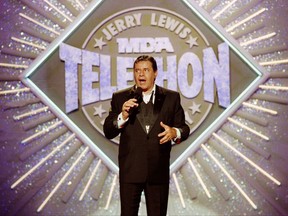 Entertainer Jerry Lewis makes his opening remarks at the 25th Anniversary of the Jerry Lewis MDA Labor Day Telethon fundraiser in Los Angeles. Lewis, the comedian whose fundraising telethons became as famous as his hit movies, has died according to his publicist.