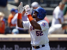 New York Mets Yoenis Cespedes gestures after hitting a solo home run during the fourth inning of a baseball game against the Arizona Diamondbacks on Thursday, Aug. 24, 2017, in New York. (AP Photo/Adam Hunger)