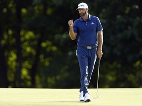 Dustin Johnson reacts on the 15th green after making a birdie putt during the final round of The Northern Trust golf tournament on Sunday, Aug. 27, 2017, in Old Westbury, N.Y. (AP Photo/Adam Hunger)