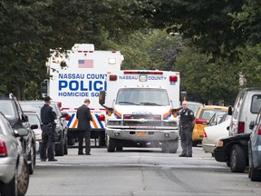 A Nassau County Police spokesman says the women died from "blunt force trauma" injuries. A fourth woman survived and his being treated at a hospital. Detective Lt. Richard Lebrun did not identify the suspect police are seeking. He did not describe the suspect.  (Howard Schnapp/Newsday via AP)