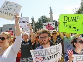 Protesters listen during a "Peace and Sanity" rally Sunday Aug. 13, 2017, in New York, as speakers address white supremacy violence in Charlottesville, Va., yesterday.