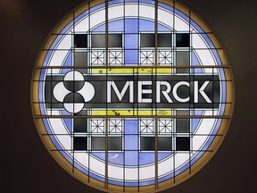 FILE - This Thursday, Dec.18, 2014, file photograph, shows the Merck logo on a stained glass panel at a Merck company building in Kenilworth, N.J. A new type of cholesterol drug meant to prevent heart attacks and other complications clearly did so, in an unusually large study whose results were announced Tuesday, Aug. 29, 2017, at a conference of heart specialists. But the daily pill only reduced those complications by 9 percent, leaving drugmaker Merck with a tough call on whether to seek regulatory approval after spending 13 years and likely hundreds of millions of dollars on testing. (AP Photo/Mel Evans, File)