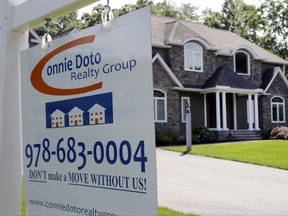 FILE - This Monday, July 10, 2017, file photo shows a house for sale, in North Andover, Mass. On Tuesday, Aug. 29, 2017, the Standard & Poor's/Case-Shiller 20-city home price index for June is released. (AP Photo/Elise Amendola, File)