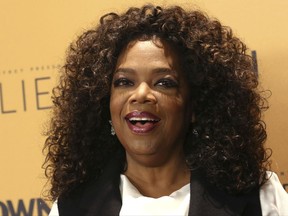 FILE - In this Wednesday, Oct. 14, 2015, file photo, Oprah Winfrey attends the premiere of the Oprah Winfrey Network's (OWN) documentary series "Belief," at The TimesCenter in New York. Winfrey is headed to the supermarket aisle with her own line of refrigerated soups and side dishes. The media mogul is launching the food line, called O, That's Good!, after creating a joint venture with Kraft Heinz Co. (Photo by Greg Allen/Invision/AP, File)