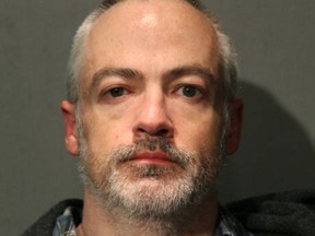 This booking photo provided by the Chicago Police Department shows Wyndham Lathem on Saturday, Aug. 19, 2017.  Lathem, a Northwestern University professor, and Andrew Warren, an Oxford University financial officer, have been charged with first-degree murder in the death of Trenton James Cornell-Duranleau, a Michigan native who had been working in Chicago. Authorities say Cornell-Duranleau suffered more than 40 stab wounds to his upper body during the July attack in Lathem's high-rise Chicago condo. Lathem and Warren surrendered peacefully to police in California on Aug. 4 after an eight-day manhunt. (Chicago Police Department via AP)