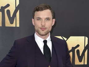 FILE - In this April 9, 2016 file photo, Ed Skrein arrives at the MTV Movie Awards in Burbank, Calif. A week after his casting in the upcoming "Hellboy" reboot sparked outcries of whitewashing, Skrein has withdrawn from the film. He was cast as Ben Daimio in the "Hellboy" reboot "Rise of the Blood Queen." Many objected to the role not going to an Asian-American actor. The character is Japanese-American in Mike Mignola's "Hellboy" comics. (Photo by Jordan Strauss/Invision/AP, File)