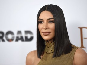 FILE - In this April 12, 2017, file photo, Kim Kardashian West arrives at the U.S. premiere of "The Promise" in Los Angeles. Kardashian West and her famous siblings are donating $500,000 to help victims of Hurricane Harvey. A spokeswoman for the reality star says she and her mother and sisters have given $250,000 to the Red Cross and $250,000 to the Salvation Army on Tuesday, Aug. 29. (Photo by Chris Pizzello/Invision/AP, File)