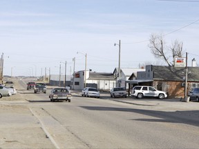 FILE - This March 6, 2006 file photo shows the unincorporated town of Whiteclay, Neb. Four months after the Nebraska Liquor Control Commission halted beer sales in Whiteclay along South Dakota's Pine Ridge Indian Reservation, streets once filled with panhandlers and public drunkenness have gone quiet - but residents say some of the problems have moved elsewhere. The Nebraska Supreme Court will review the decision with oral arguments Tuesday, Aug. 29, 2017. (AP Photo/Nati Harnik, File)