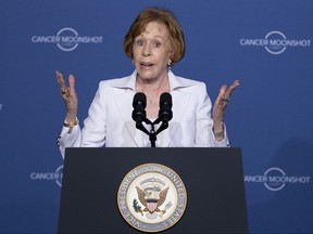 FILE - In this June 29, 2016, file photo, actress, comedian Carol Burnett speaks at the Cancer Moonshot Summit at Howard University in Washington before introducing Vice President Joe Biden. Burnett says she'll be playing her inner self in a new Netflix series: An 8-year old. Netflix announced Monday, July 31, 2017, that the comedy great will star in an unscripted comedy series titled "A Little Help with Carol Burnett." (AP Photo/Carolyn Kaster, File)