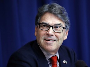 FILE - In this July 18, 2017, file photo, Energy Secretary Rick Perry attends a news conference at the National Press Club in Washington. The Energy Department said Wednesday, Aug. 23, the government should make it easier and cheaper to operate power plants, including coal and nuclear plants, to strengthen the nation's electric grid. (AP Photo/Jacquelyn Martin, File)