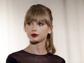FILE - In this Oct. 12, 2103 file photo, Taylor Swift appears at the Country Music Hall of Fame and Museum in Nashville, Tenn. David Mueller, a former radio host, claims in a lawsuit that he lost his job because Swift falsely accused him of groping her. Swift has countersued, alleging she's the victim of sexual assault. Mueller is seeking up to $3 million in damages at the trial that begins Monday, Aug. 7, 2017, in federal court in Denver. Both sides say no settlement is in the works. (AP Photo/Mark Humphrey, File)
