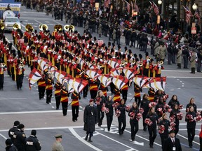 FILE- In this Jan. 21, 2013, file photo, The University of Maryland "Mighty Sound of Maryland" Marching Band performs during the 57th Presidential Inaugural Parade on Pennsylvania Avenue in Washington. The marching band will at least temporarily stop playing the state's official song, which includes a reference to "Northern scum" and other pro-Confederate lyrics. (AP Photo/Alex Brandon, File)