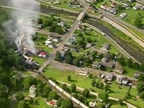 In this aerial image made from a video provided by WPXI, smoke rises into the air after dozens of cars of a freight train carrying hazardous materials derailed in Hyndman, Pa., Wednesday, Aug. 2, 2017. County officials ordered all residents of the small Pennsylvania town to evacuate after the derailment. (WPXI via AP)