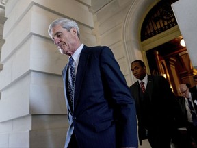 FILE- In this June 21, 2017, file photo, former FBI Director Robert Mueller, the special counsel probing Russian interference in the 2016 election, departs Capitol Hill following a closed door meeting in Washington. A grand jury used by Mueller has heard secret testimony from a Russian-American lobbyist who attended a June 2016 meeting with President Donald Trump's eldest son, The Associated Press has learned. (AP Photo/Andrew Harnik, File)
