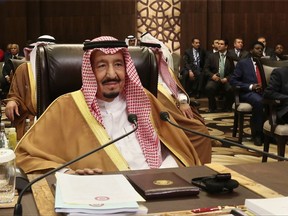 FILE - In this March 29, 2017 file photo, Saudi Arabia's King Salman attends the summit of the Arab League at the Dead Sea, Jordan. Ten Nobel Peace Prize winners are appealing to Saudi Arabia's king and crown prince to show mercy and halt the executions of 14 young people sentenced to death for participating in protests in 2012. In a letter released Friday, Aug. 11, the laureates say the 14 minority Shiites were convicted in a mass trial and sentenced "based on the actions of the worst defendant." (AP Photo/Raad Adayleh, File)