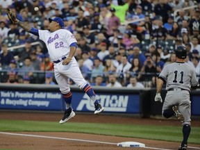 New York Yankees' Brett Gardner (11) is safe at first base as New York Mets first baseman Dominic Smith (22) loses control of the ball during the first inning of a baseball game Thursday, Aug. 17, 2017, in New York. (AP Photo/Frank Franklin II)