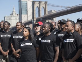 Retired New York City Police Officer Frank Serpico, center, stands with other members of law enforcement during a rally to show support for Colin Kaepernick, Saturday, Aug. 19, 2017, in New York. Kaepernick, the former quarterback for the San Francisco 49ers, became a controversial figure last year after he refused to stand for the national anthem. He said it was a protest against oppression of black people. (AP Photo/Mary Altaffer)