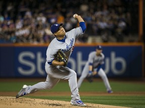 Los Angeles Dodgers starting pitcher Hyun-Jin Ryu (99)  delivers in the first inning against the New York Mets during a baseball game, Sunday Aug. 6, 2017, in New York.(AP Photo/Michael Noble Jr.)