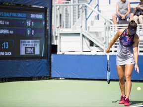 Ipek Soyluas, of Turkey, prepares to serve as the serve clock ticks down Thursday, Aug. 24, 2017, during U.S. Open tennis qualifying in New York. The serve clock is one of the changes being tested at the tournament. If Stacey Allaster, the U.S. Tennis Association's chief executive for professional tennis, has her way, changes such the serve clock and in-match coaching could make their way into the main draw of the tourney next year. (AP Photo/Michael Noble Jr.)