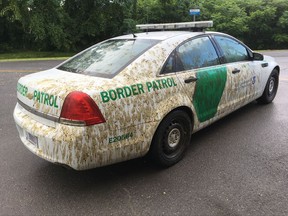 This Aug. 3, 2017 photo provided by U.S. Customs and Border Protection shows a U.S. Border Patrol car that had been sprayed with manure in Alburgh, Vt. Mark Johnson is charged with spraying liquid manure on a marked U.S. Customs and Border Protection car after confronting an agent about immigration enforcement. (U.S. Customs and Border Protection via AP)