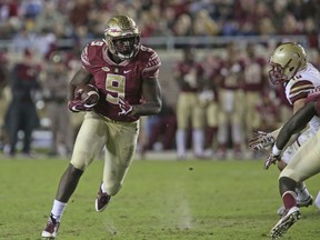 FILE - This Nov. 11, 2016 photo shows Florida State's Jacques Patrick looking for running room against Boston College's defense in an NCAA college football game in Tallahassee, Fla.  After two years of being behind Dalvin Cook on the depth chart, Jacques Patrick is ready to take the lessons he learned from watching Cook and become Florida State's lead running back this season. (AP Photo/Steve Cannon)