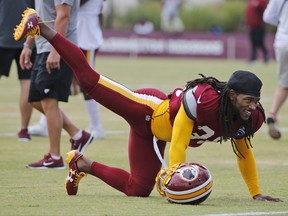 FILE - This Aug. 1, 2017 file photo shows Washington Redskins free safety D.J. Swearinger (36) stretching during practice at the Washington Redskins NFL training camp in Richmond, Va. The Redskins are hoping Swearinger is the answer at their free safety position. The team signed the 25 year old in the offseason and also gained a very vocal leader. Swearinger celebrates each defensive stand the defense makes, even in practice, and says he views it as his job to keep energy levels high. (AP Photo/Steve Helber, file)