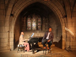 In this Dec. 9, 2015 photo, provided by Andrew Ousley, tenor Lawrence Brownlee, accompanied by pianist Damien Sneed, performs in New York's Crypt Chapel of the Church of the Intercession. Brownlee will be presenting a program, Friday, Aug. 11, 2017, in New York's Park Avenue Armory, singing songs and talking about his experiences as a black man. (Andrew Ousley via AP)