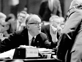 FILE - In this Aug 29, 1967, file photo, Judge Charles S. Desmond, left, talks with fellow delegate Peter J. Crotty, after he spoke during the Constitutional Convention in Albany, N.Y., Corruption and a rigged political system are battle cries of both sides in a debate over whether New Yorkers should vote this fall to rewrite the state constitution. Advocates of a "yes" vote say a constitutional convention is the only way to fix corruption and inefficiency in government. But opponents say a convention would be rife with corruption and could strip away constitutional protections of the environment, labor and reproductive rights. (AP Photo/File)