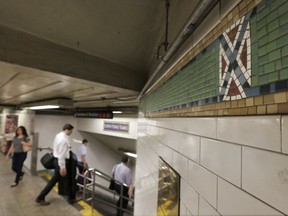 The mosaic tile design meant to represent Times Square's status as the "Crossroads of the World" is part of the subway station's border, in New York, Friday, Aug. 18, 2017. Transit officials have decided to alter subway tiles at the station that have a design that's been compared to the Confederate flag, to make it "crystal clear" that they don't depict the flag. (AP Photo/Richard Drew)