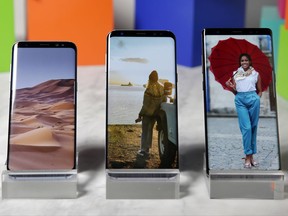 This Aug. 16, 2017, photo, shows a Samsung Galaxy S8, left, a Samsung Galaxy S8 Plus, center, and Samsung Galaxy Note 8 on display, in New York. (AP Photo/Richard Drew)