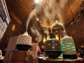 In this Aug. 8, 2017 photo, essential oil diffusers with the home decor aspect, from Airome, in Draper, Utah, are shown at the annual International Spa Association event, in New York. Wellness rather than beauty was the message this week as the spa industry gathered in New York for an annual event organized by the International Spa Association. While there were plenty of skin products and treatments on display, the bigger trend remains alleviating stress.(AP Photo/Richard Drew)