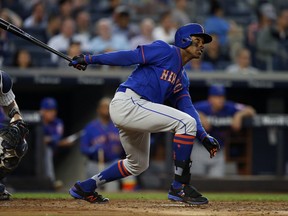 New York Mets' Curtis Granderson hits a home run against the New York Yankees during the third inning of a baseball game Monday, Aug. 14, 2017, at Yankee Stadium in New York. (AP Photo/Rich Schultz)