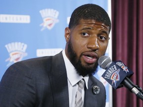 FILE - In this Wednesday, July 12, 2017, file photo, Oklahoma City Thunder forward Paul George answers a question at his first news conference since Oklahoma City's blockbuster trade with the Indiana Pacers, in Oklahoma City. On Sunday, Aug. 20, 2017, the NBA said it has opened an investigation to see if the Los Angeles Lakers tampered with George while he was under contract with the Indiana Pacers. The probe is being handled by the New York-based law firm of Wachtell, Lipton, Rosen & Katz, and the NBA said the Lakers have cooperated with the ongoing investigation. (AP Photo/Sue Ogrocki, File)