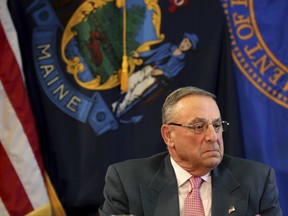 FILE- In this May 10, 2017, file photo, Maine Gov. Paul LePage pauses during a meeting to discuss the state's efforts to fight the opioid epidemic at the State House in Augusta, Maine. The American Civil Liberties Union of Maine sued LePage on Tuesday, Aug. 8, 2017, for blocking critics on his official Facebook page and deleting their comments. The ACLU filed the federal lawsuit on behalf of two women, saying their First Amendment rights were violated.  (AP Photo/Robert F. Bukaty, File)