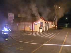 In a photo provided by the Seabrook N.H. Fire Department, firefighters work on a fire at Brown's Lobster Pound, a longtime seafood restaurant in Seabrook, New Hampshire, which was heavily damaged by fire early Sunday, Aug. 20, 2017. Authorities are investigating what caused the fire. The owners say they will reopen as soon as possible.  (Francis Emond/Seabrook N.H. Fire Department via AP)