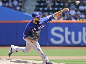 Texas Rangers starting pitcher Martin Perez throws during the first inning of a baseball game against the New York Mets at Citi Field, Wednesday, Aug. 9, 2017, in New York. (AP Photo/Seth Wenig)