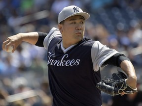 New York Yankees starting pitcher Masahiro Tanaka (19) delivers to the Seattle Mariners during the first inning of a baseball game Sunday, Aug. 27, 2017, at Yankee Stadium in New York. (AP Photo/Bill Kostroun)