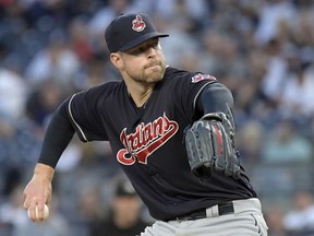 Cleveland Indians pitcher Corey Kluber delivers the ball to the New York Yankees during the first inning of a baseball game, Monday, Aug. 28, 2017, at Yankee Stadium in New York. (AP Photo/Bill Kostroun)