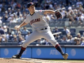 Cleveland Indians starting pitcher Trevor Bauer delivers the ball to the New York Yankees during the first inning in the first game of a baseball doubleheader Wednesday, Aug. 30, 2017, at Yankee Stadium in New York. (AP Photo/Bill Kostroun)