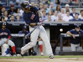 Boston Red Sox's Hanley Ramirez hits a two-run home run during the first inning of the team's baseball game against the New York Yankees on Friday, Aug. 11, 2017, in New York. (AP Photo/Frank Franklin II)