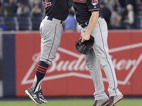Cleveland Indians shortstop Francisco Lindor, left, and right fielder Jay Bruce celebrate after the Indians defeated the New York Yankees 6-2 in a baseball game, Monday, Aug. 28, 2017, at Yankee Stadium in New York. (AP Photo/Bill Kostroun)