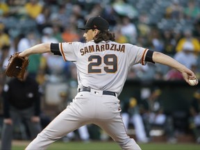 San Francisco Giants starting pitcher Jeff Samardzija works in the first inning of a baseball game against the Oakland Athletics Tuesday, Aug. 1, 2017, in Oakland, Calif. (AP Photo/Eric Risberg)
